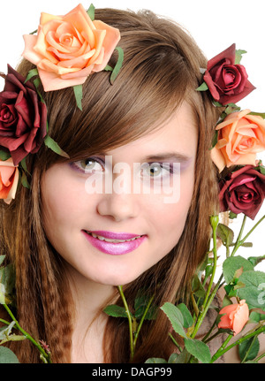 Beautiful smiling girl with roses, portrait close up Stock Photo