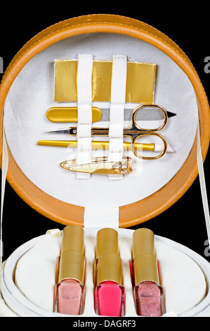 Manicure set and nail varnish in a round case. Stock Photo