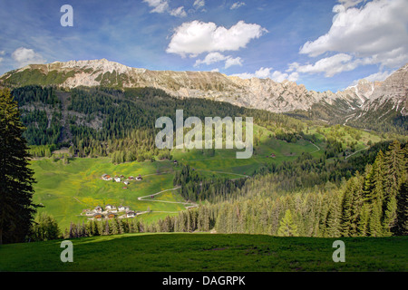 hamlets on mountain slope of Sasso di Santa Croce, Italy, South Tyrol, Dolomites Stock Photo