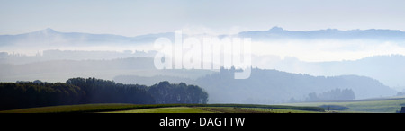 Eifel low mountain range in morning mist, view to Nuerburg and Hohe Acht, Germany, Rhineland-Palatinate, Hohe Eifel, Leudersdorf Stock Photo