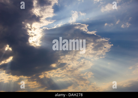 Sunlight shining through dramatic clouds Stock Photo