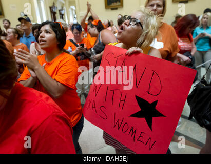 Hundreds of pro-life and pro-choice activists crowd inside the Texas Capital rallying for and against a new law relating to abortion restrictions, creating chaos inside the Capital rotunda Stock Photo
