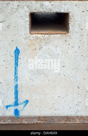 Concrete and Metal with Painted Blue Arrow Stock Photo