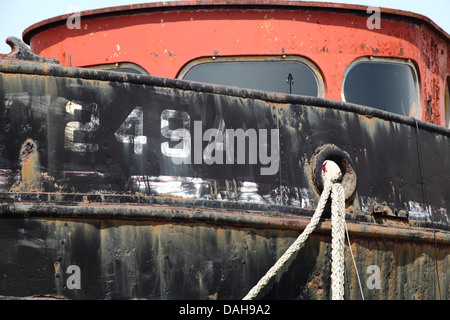 An old ship converted for use as a houseboat at Shoreham Beach, UK ...