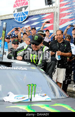 July 13, 2013 - Loudon, NH, USA - July 13, 2013 - Loudon, New Hampshire U.S. - Nationwide Series driver Kyle Busch climbs out of his car after winning the NASCAR Nationwide Series CNBC Prime's ''The Profit'' 200 race being held at the New Hampshire Motor Speedway in Loudon, New Hampshire. Eric Canha/CSM Stock Photo