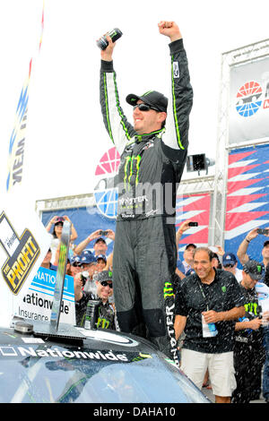 July 13, 2013 - Loudon, NH, USA - July 13, 2013 - Loudon, New Hampshire U.S. - Nationwide Series driver Kyle Busch celebrates on his car after winning the NASCAR Nationwide Series CNBC Prime's ''The Profit'' 200 race being held at the New Hampshire Motor Speedway in Loudon, New Hampshire. Eric Canha/CSM Stock Photo
