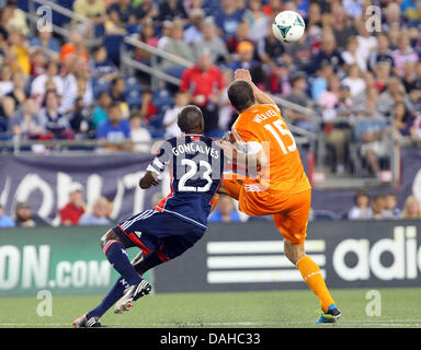 Foxborough, Massachusetts, USA. 13th July, 2013. New England Revolution defender Jose Goncalves (23) and Houston Dynamo forward Cam Weaver (15) battle for the ball during the MLS game between the New England Revolution and Houston Dynamo at Gillette Stadium in Foxborough, Massachusetts. Houston defeated New England 2-1. Anthony Nesmith/CSM/Alamy Live News Stock Photo