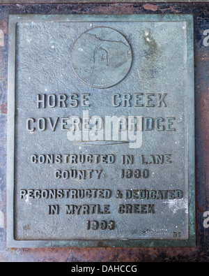 Myrtle Creek Oregon United States.  Plaque marking Horse Creek covered bridge which spans Myrtle Creek in Douglas County Oregon Stock Photo