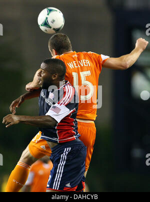 Foxborough, Massachusetts, USA. 13th July, 2013. Houston Dynamo forward Cam Weaver (15) and New England Revolution defender Andrew Farrell (2) in action during the MLS game between the New England Revolution and Houston Dynamo at Gillette Stadium in Foxborough, Massachusetts. Houston defeated New England 2-1. Anthony Nesmith/CSM/Alamy Live News Stock Photo