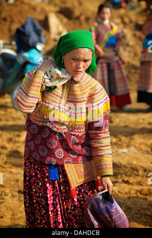 Flower Hmong woman in distinctive tribal costume.  Can Cau market, N Vietnam Stock Photo