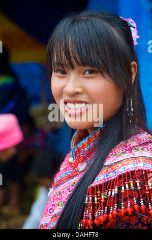 Portrait of a Flower Hmong woman in distinctive tribal costume, Bac Ha, Vietnam Stock Photo