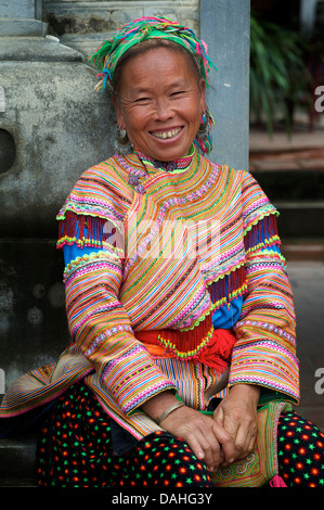 Portrait of a Flower Hmong woman in distinctive tribal costume, Bac Ha, Vietnam Stock Photo