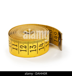 Close-up of yellow old tape measure on white background Stock Photo
