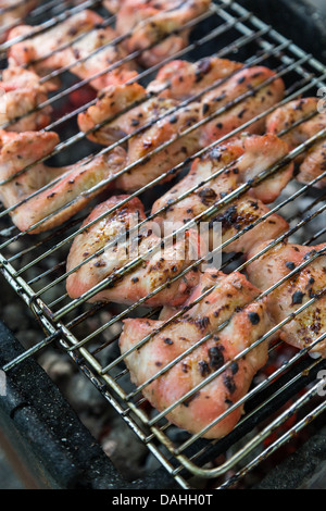 juice marinated chicken wings in grilled barbecue Stock Photo