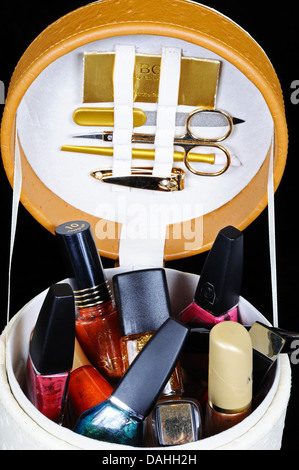 Manicure set and nail varnish in a round case. Stock Photo
