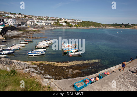 Boats moored at the pretty coastal village of Portscatho on the Roseland Peninsula, Cornwall. Stock Photo