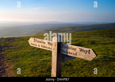 The Pennine Way National Trail on the summit of Pen-y-Ghent, near Horton-in-Ribblesdale, Yorkshire Dales, UK Stock Photo