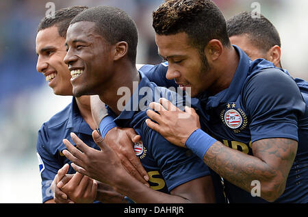 Hanover, Germany. 14th July, 2013. Eindhoven's Georgino Wijnaldum (L-R), Memphis Depay and Zakaria Bakkali celebrate the 1-0 goal during the test match between Hannover 96 and PSV Eindhoven at HDI Aren in Hanover, Germany, 14 July 2013. Photo: PETER STEFFEN/dpa/Alamy Live News Stock Photo