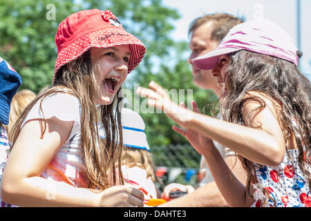 London, UK. 14th July, 2013. Sunshine, Pimms, face painting and sumo - all part of a modern British Summer Fair.  Nightingale Lane, London UK. Credit:  Guy Bell/Alamy Live News Stock Photo