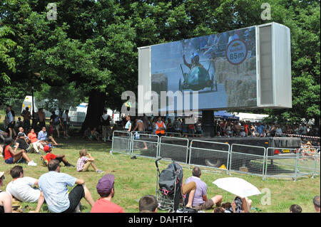 Alexandra Palace, London, UK. 14th July 2013. Watching the Red Bull Soapbox race on the big screen at Alexandra Palace. The Red Bull Soapbox Race at Alexandra Palace, is an international event in which amateur drivers race homemade soapbox vehicles. 'Each hand-made machine is fuelled by nothing but sheer courage, the force of gravity and perhaps a little Red Bull. Credit:  Matthew Chattle/Alamy Live News Stock Photo