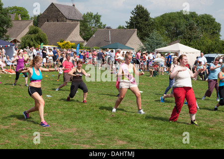 Members of the local community taking part in a zumba fitness demonstration in Crich, Derbyshire, U.K. Stock Photo