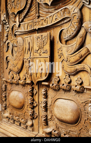 Intricate wood carvings on the entrance door outside of Bath Abbey also known as the Abbey Church of Saint Peter and Saint Paul Stock Photo