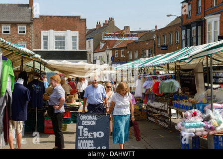 Shoppers browse the market stalls in Beverley town centre UK Stock ...