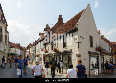 Shoppers walking along Toll Gavel through Beverley town centre UK Stock Photo