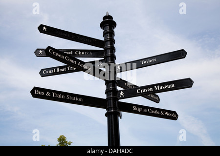 Finger-post signposts Metal street tourist information signs to different destinations in the town of Craven, Skipton, North Yorkshire, UK Stock Photo