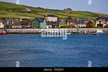 Colorful coastal harbor waterfront with boats, blue sky in Dingle Peninsula, Ireland, Europe, EU Irish landscapes vintage beach Stock Photo