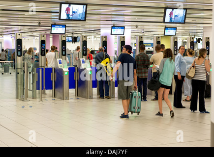 Going through security at Gatwick Airport. Stock Photo