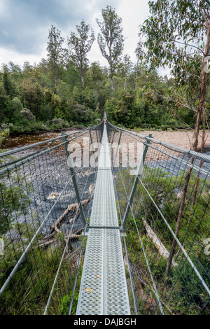 A swing bridge spans the spectacular Huon river and the Tahune Forest. Near Geeveston, Tasmania. Stock Photo