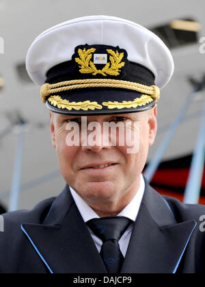 Captain Detlef Harms stands in front of the new cruise ship AIDAsol in Kiel, Germany, 5 April 2011. On 9 April 2011 the ship will be baptized. PHOTO: CARSTEN REHDER Stock Photo