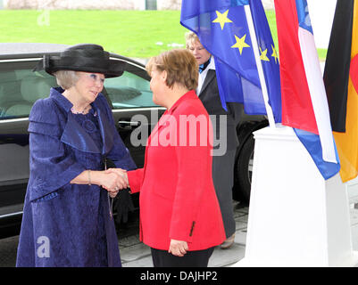 Queen Beatrix is welcomed by German Chancellor Angela Merkel (R) at the Chancellery in Berlin, Germany, 12 April 2011. The royal family is on a four-day-visit to Germany. Photo: Albert Nieboer / NETHERLANDS OUT Stock Photo