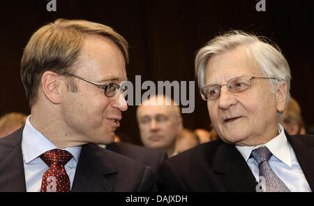 The new German central bank (Bundesbank) president Jens Weidmann (L) talks to European central Bank President Jean-Claude Trichet during a hand-over ceremony at the Bundesbank headquarter in Frankfurt, May 2, 2011. Photo by Kai Pfaffenbach dpa/lhe Stock Photo