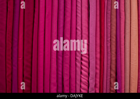 Fabrics lined up on a rack Stock Photo