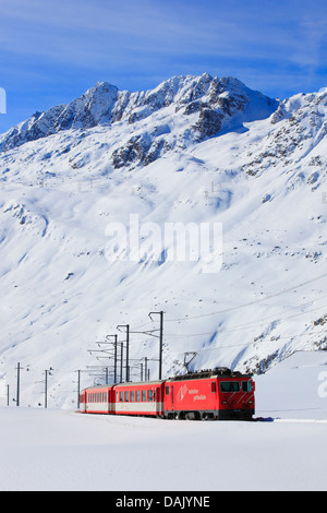 the Matterhorn Gotthard Bahn in snow-covered mountain panorama, Switzerland, Andermatt Stock Photo