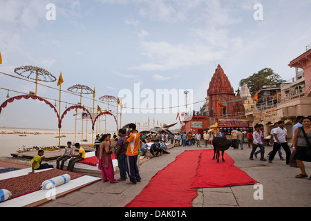 Tourists at a ghat, Dashashwamedh Ghat, Varanasi, Uttar Pradesh, India Stock Photo