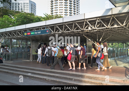 dh  DOWNTOWN SINGAPORE Crowds people at entrance City Hall MRT station metro Stock Photo