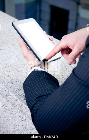 Businessman working on tablet Stock Photo