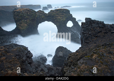 rock window at the coast of Arnarstapi, Iceland, Snaefellsness Stock Photo