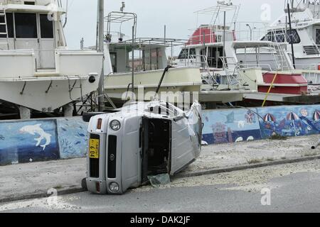 July 13, 2013, Ishigaki, Okinawa, Japan - Cars are damaged by typhoon No.7 'Soulik' in Ishigaki Island, Okinawa, Japan, on Saturday July 13, 2013. Soulik had a minimum central pressure of 950 hectopascals and wind speed of up to144 kilometers per hour near its center.  It was close to Ishigaki and Japan's southwestern islands in early afternoon on July 12. About 16,000 homes was without electricity On Ishigaki, Miyako and nearby smaller islands from the evening on July 13. (Photo by Wataru Kohayakawa/AFLO) -ks- Stock Photo
