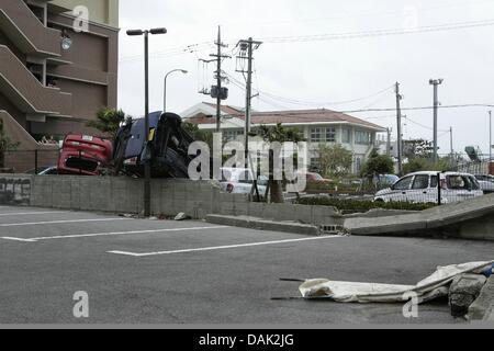 July 13, 2013, Ishigaki, Okinawa, Japan - Cars are damaged by typhoon No.7 'Soulik' in Ishigaki Island, Okinawa, Japan, on Saturday July 13, 2013. Soulik had a minimum central pressure of 950 hectopascals and wind speed of up to144 kilometers per hour near its center.  It was close to Ishigaki and Japan's southwestern islands in early afternoon on July 12. About 16,000 homes was without electricity On Ishigaki, Miyako and nearby smaller islands from the evening on July 13. (Photo by Wataru Kohayakawa/AFLO) -ks- Stock Photo