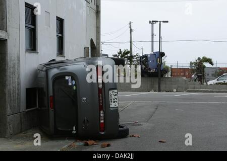 July 13, 2013, Ishigaki, Okinawa, Japan - Cars are damaged by typhoon No.7 'Soulik' in Ishigaki Island, Okinawa, Japan, on Saturday July 13, 2013. Soulik had a minimum central pressure of 950 hectopascals and wind speed of up to144 kilometers per hour near its center.  It was close to Ishigaki and Japan's southwestern islands in early afternoon on July 12. About 16,000 homes was without electricity On Ishigaki, Miyako and nearby smaller islands from the evening on July 13. (Photo by Wataru Kohayakawa/AFLO) -ks- Stock Photo