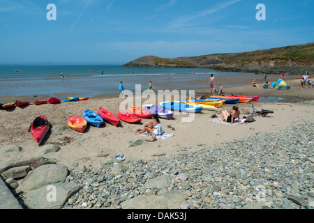 Kayaks and canoes for hire on the beach at Whitesands Bay St Davids Pembrokeshire Wales in the UK heatwave of 2013