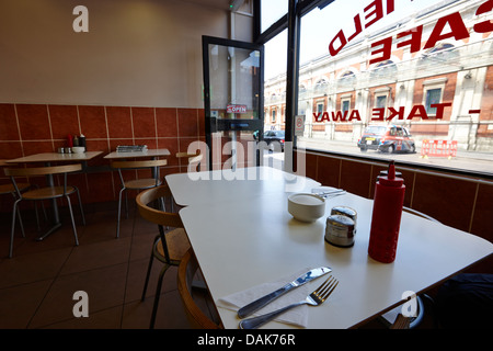 small cafe tables and window at smithfield market london, england uk Stock Photo