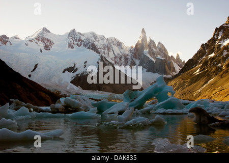 Cerro Torre, icebergs at the Laguna Torre, backlight (evening), Chile, Patagonia, Los Glaciares National Park, El Chalten Stock Photo