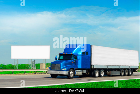 big rig cargo truck and road billboard Stock Photo