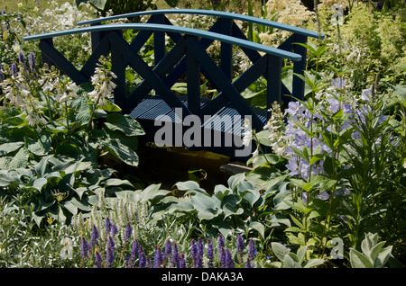 The bridge in the Willow Pattern Summer Garden at RHS Hampton Court Palace Flower Show 2013. Stock Photo