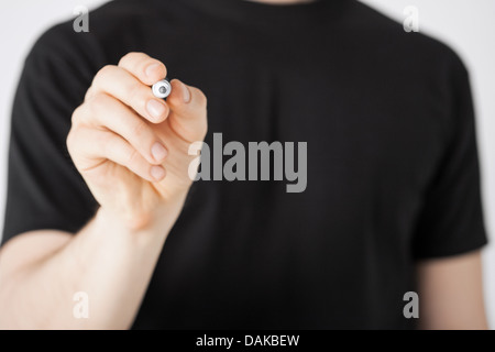 man writing something in the air Stock Photo